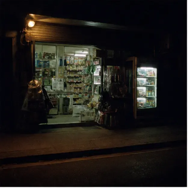 Corner shop after dark in the Night Roll style