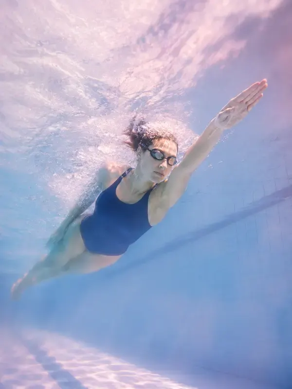 Swimmer under the pool surface in the Opal Focus style