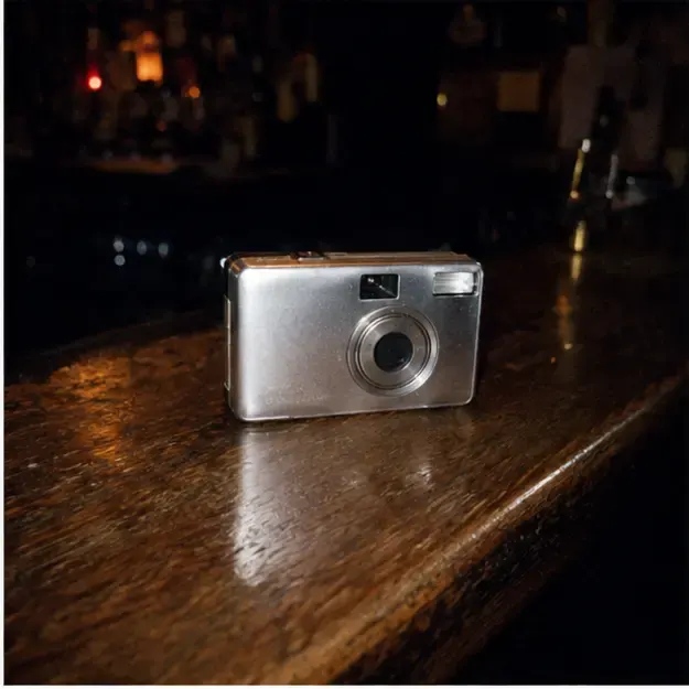 Chrome camera on a bar in the Night Roll style